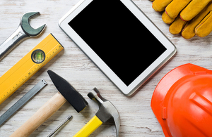 Tablet computer surrounded by tools