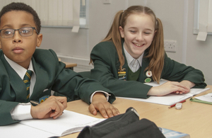 Girl and boy pupils at desk