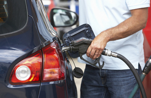 Man putting petrol in a car