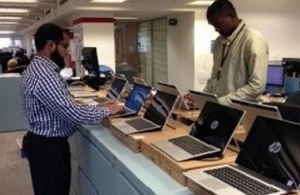 Staff setting up new tablet devices