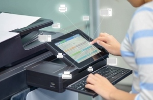 office worker using a printer to scan a document