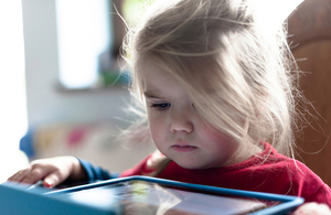 Child playing with a tablet