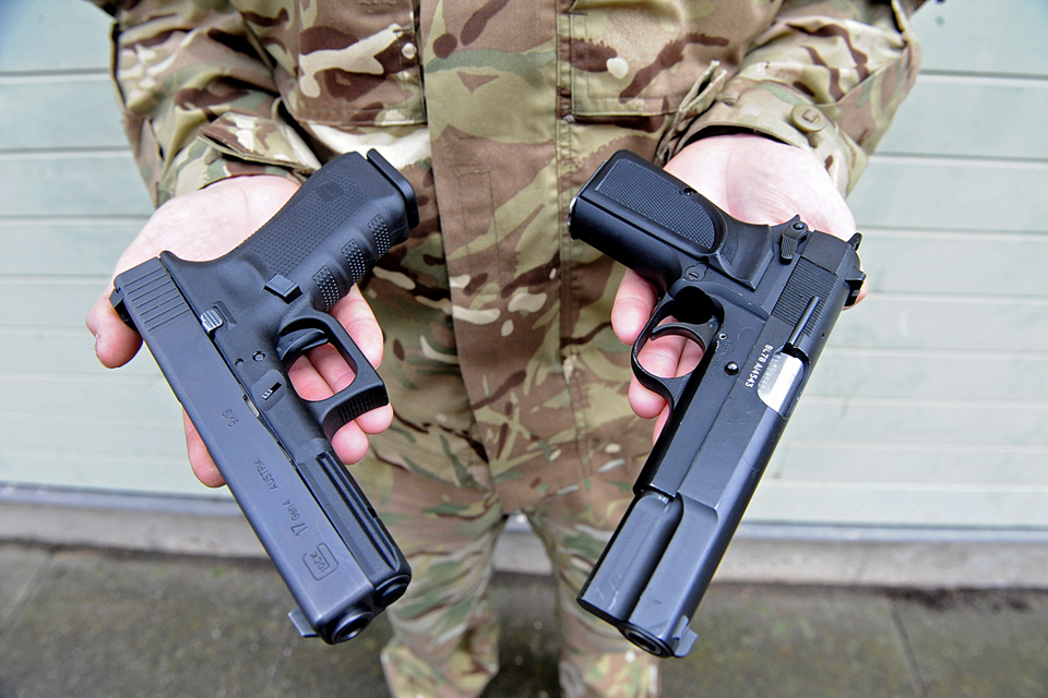 Glock 17 pistol (left) and a Browning 9mm pistol