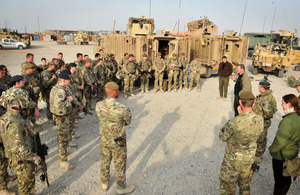 Andrew Robathan and Philip Dunne talk with soldiers from the Royal Dragoon Guards and 1st Battalion The Duke of Lancaster's Regiment at Main Operating Base Lashkar Gah in Afghanistan [Picture: Corporal Mike O'Neill, Crown Copyright/MOD 2013]