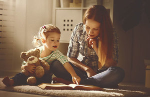 Mother reading her child a book