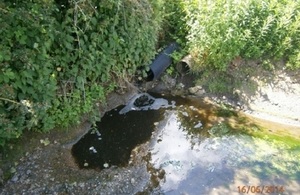 Image shows pollution in the watercourse