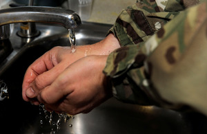 Soldier washes hands. Image by Sergeant Jez Doak (Crown Copyright 2013)