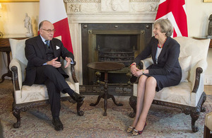 Prime Minister Theresa May speaking with Prime Minister Cazeneuve of France.
