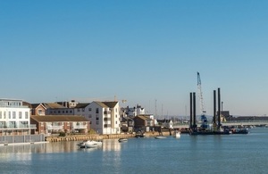 A photo showing the coastline at Shoreham, including the jack-up barge that has been working on sheet piling to reduce flood risk