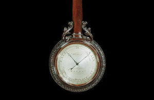 A George III mahogany wheel barometer