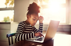 Young girl using laptop computer