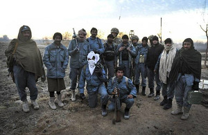 Members of the Afghan Uniform Police pose for a group photo [Picture: Corporal Mike O'Neill RLC, Crown Copyright/MOD 2012]