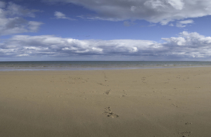 Flat beach, shoreline and cloudscape