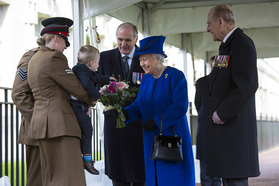 HM The Queen presented with a posy by two-year-old Alfie Lunn. Crown Copyright.