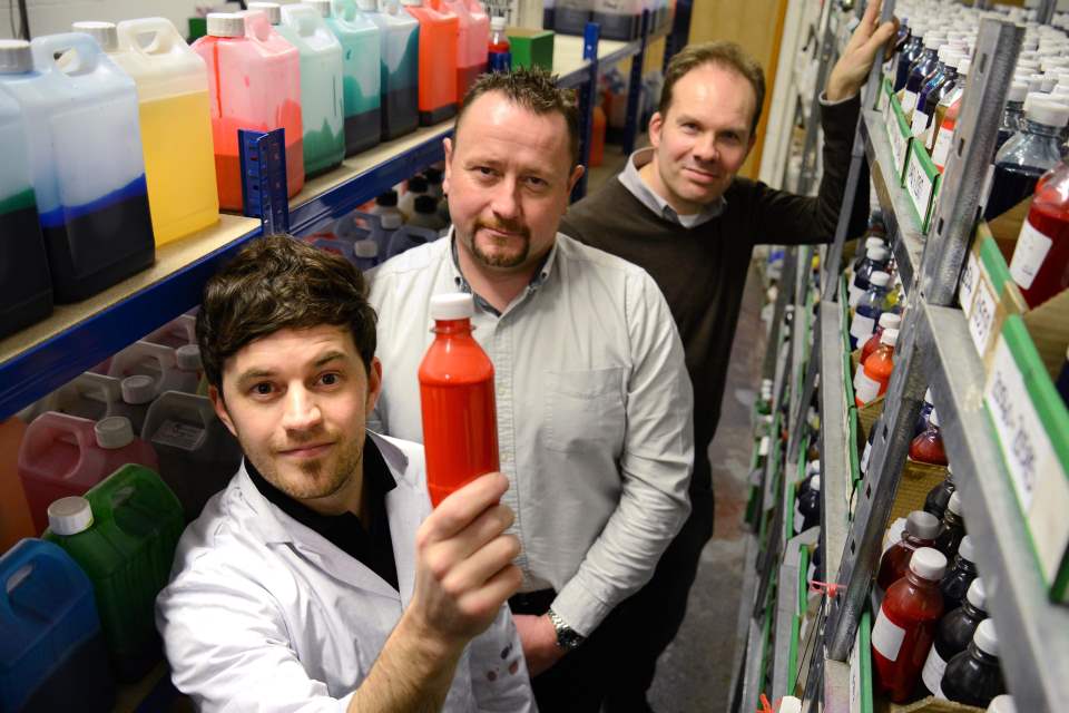 KTP partners in the paint store room with products on shelves