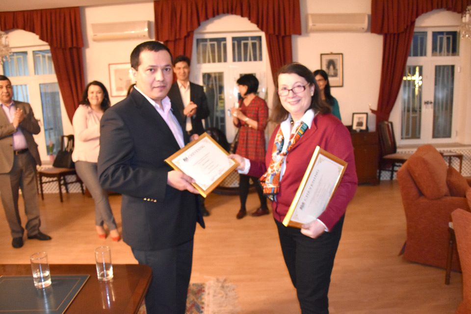 Ambassador Abbott-Watt presents Yakup Anannepesov with a certificate