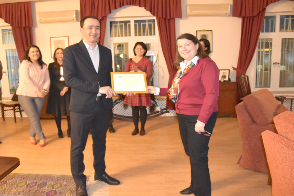 Ambassador Abbott-Watt presents Vepa Resulov with a certificate
