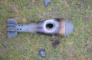 Damage sustained to the thick metal casing of a mortar bomb by the test laser