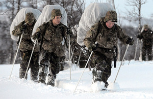 A naval officer leads his men on a navigation exercise [Picture: Crown Copyright/MOD 2013]