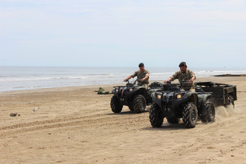 His Majesty test driving the British Forces Brunei all-terrain quad bike with Lieutenant Colonel Charlie Crowe