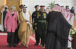 The Prime Minister walking with King Salman