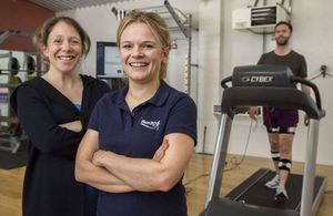 Founder Dr Jessica Bruce (left) and physiotherapist Andrea Bachand in a room with athlete on running machine in the background.