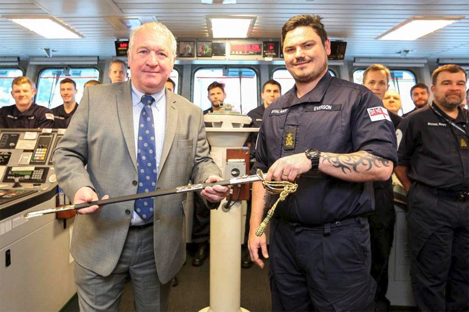 PO Everson accepts the Firmin Sword from Minister for the Armed Forces Mike Penning