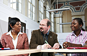 Three people sitting at a table