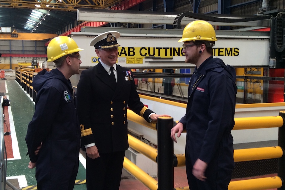 Commodore Peter Coulson talking to workers at Govan shipyard, where the first sheet of steel was cut for HMS Spey. 