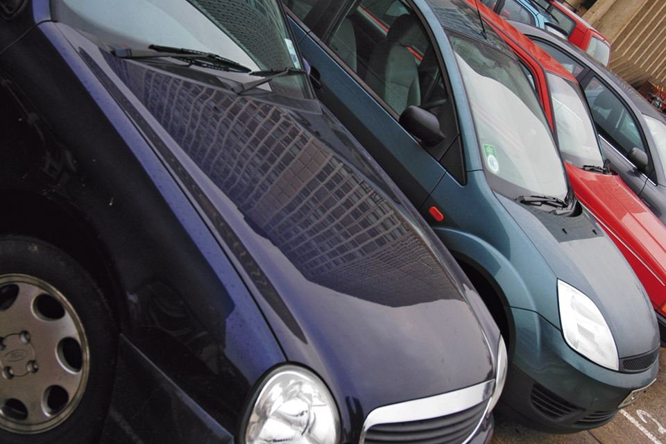Image of row of parked cars in a car park