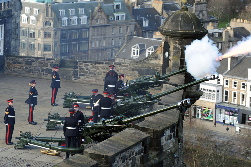 Gunners from 105 Regiment Royal Artillery (Volunteers) firing a 21-gun royal salute 