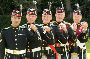 From left: Military Cross recipients Captain Alexander Phillips, Sergeant Richard Clark, Corporal Craig Sharp and Corporal Christopher Reynolds, along with Lieutenant Colonel Stephen Cartwright holding his Order of the British Empire medal [Picture: Mark