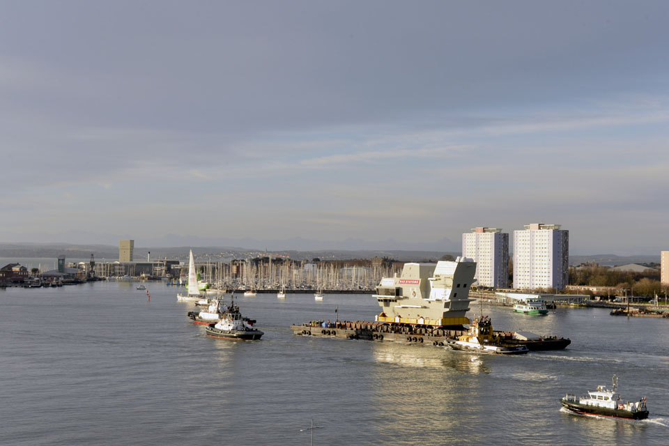 The forward island section of HMS Queen Elizabeth leaves Portsmouth Naval Base