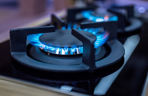 Kitchen stove with blue flames burning