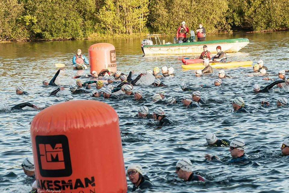 Competitors complete the swim part of the challenge
