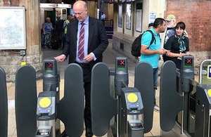 Picture of Chris Grayling trying the ticket system.