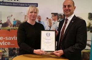 Clare Read, Head of Regional Health and Safety Support Team, and Geoff Robson, Chief Operating Officer, with the RoSPA Gold Award. Crown Copyright MOD 2017. All rights reserved.