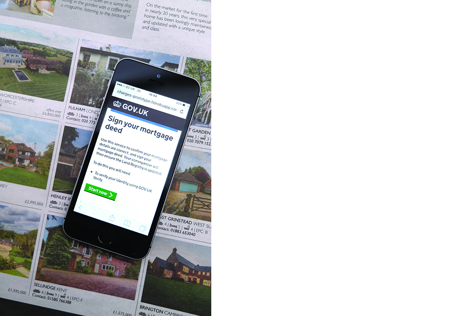 photo of mobile phone showing Sign your deed online