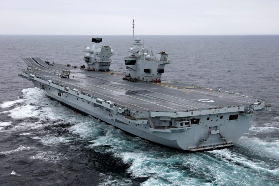 The Defence Secretary landed by Merlin helicopter on the deck of HMS Queen Elizabeth.