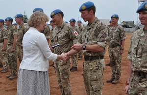 HMA Alison Blackburne presents commander Lt Col Jason Ainley with his UNMISS medal in Juba.