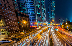 Blurred lights from traffic on a road.