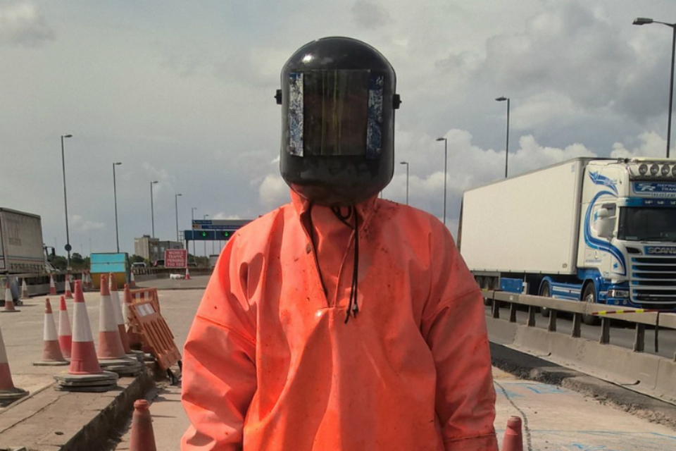 image of worker in protective gear