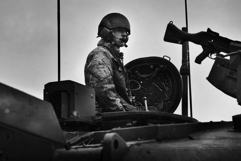 A member of the Queen's Royal Hussars in a Challenger 2 main battle tank