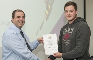 Zac Hall receiving the IET Student Excellence Prize from Tim Heywood, IET