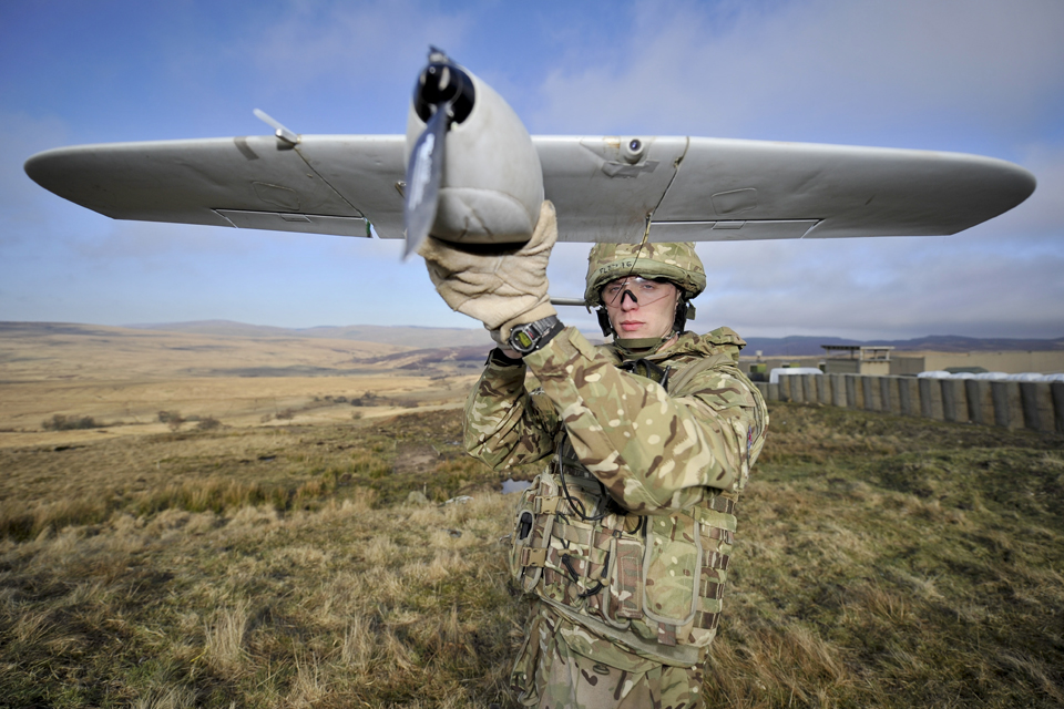 Bombardier Sam Fletcher with a Desert Hawk unmanned aerial vehicle