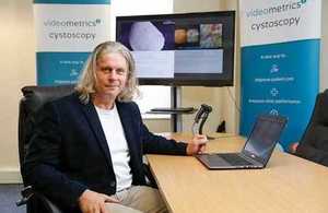 Will Dracup, CEO of Biogsignatures, at his office desk.