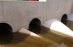 Shot of 4 culverts beneath road in Cannington, inside which are installed hydrobrakes