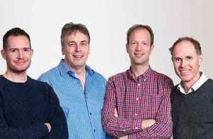 Genomics four-man management team in casual gear.