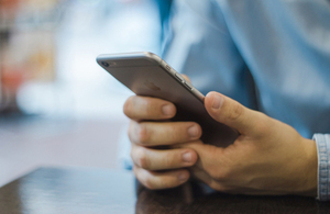 Hands using mobile phone