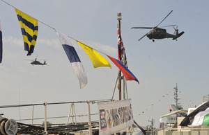 Military helicopters fly over Royal Navy warships during IDEX 2013 in Abu Dhabi [Picture: Leading Airman (Photographer) Maxine Davies, Crown copyright]